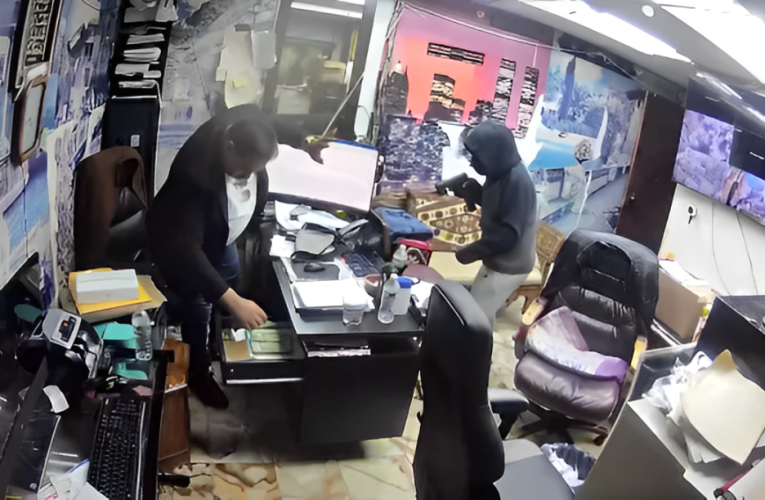 Caught on Camera: Masked Gunman Steals $30,000 and Important Documents in Paterson Robbery!