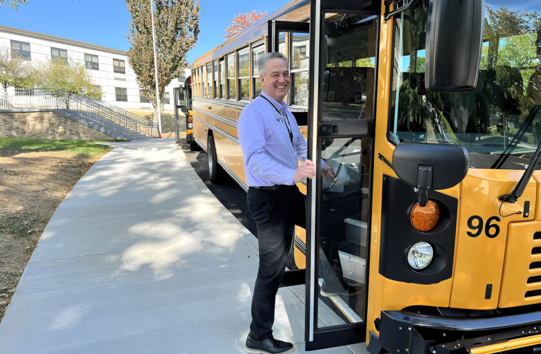 Shocking Safety Concerns: Family Fears for Kids at Dangerous Bus Stop Near Heavy Truck Traffic!