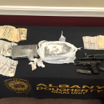 Shocking Motel Six Raid: Albany Man Caught with Firearms and Narcotics!